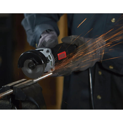 Three Inch Electric Cutoff Tool With Six Amp Motor cutting metal, high speed up to 20k RPM, sparks flying during use