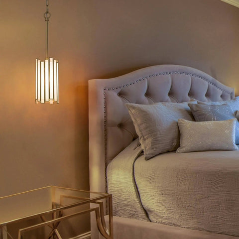 Gold Pendant Lighting With White Glass Cylinder For Kitchen Island, Hallway, Foyer, Bedroom, And Dining Room beside a bed