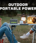 Outdoor scene with 12V LiFePO4 BT10 Battery with Built-In BMS 128Wh Portable UPS Backup on table, powering lantern and radio.