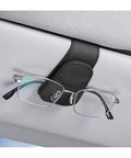 Premium Microfiber Leather Magnetic Sunglasses Holder For Car Sun Visor With Strong Grip and Sleek Black Finish securing glasses on visor.