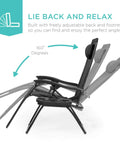 Set Of 2 Adjustable Zero Gravity Lounge Chairs With Steel Mesh, Pillows, And Cup Holder Trays shown in reclining positions, Black.
