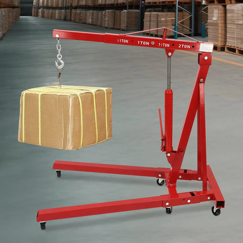 Heavy Duty Foldable Shop Crane Engine Hoist Rolling Cherry Picker With 4409 Lb Capacity hydraulic boom lifting a box in a workshop.