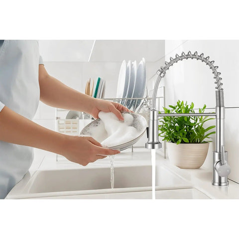 User rinsing a soapy dish under Smooth Operator Pull Down Kitchen Faucet With Brushed Nickel Finish Single Handle Control 360 Degree Swivel Spout Two Mode Spray Head For Dang Fast Cleanup And Killer Build Quality.