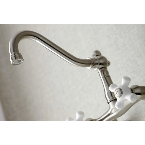 Close-up of Old School Vintage Style Wall Mount Kitchen Faucet in Brushed Nickel, Swivel Victorian Spout, white handles visible
