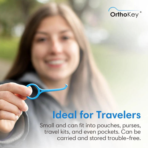 Clear Aligner Removal Tool For Braces Retainers And Dentures Hygienic On The Go Orthodontic Cleaner And Remover Key Portable 2 Pack Blue Dental Grade For Easy Travel And Everyday Use held in hand