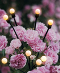 8 Pack Solar Powered Firefly Lights Outdoor Waterproof With Dual Modes Steady Glow And Flashing Swirling Warm White among flowers