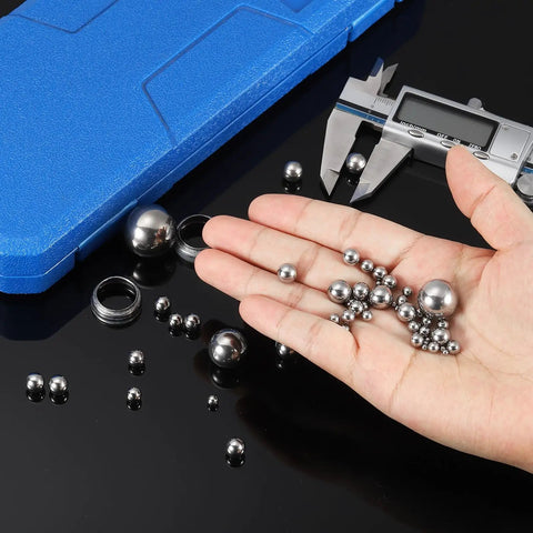 Hand holding Seven Eighths Inch Bearing Balls 316 Stainless Steel Precision Balls Mirror Finish G1000 Grade Two Pack