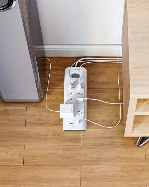 Power Strip Surge Protector With USB, 6 Foot Extension Cord, 8 Outlets And 2 USB Ports on wooden floor, flat plug in use