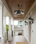 20 Inch Industrial Cage Ceiling Fan with 7 ABS Blades hanging in a porch area with wooden ceiling and black outdoor lighting