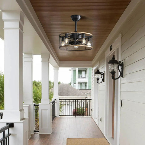 20 Inch Industrial Cage Ceiling Fan with 7 ABS Blades hanging in a porch area with wooden ceiling and black outdoor lighting