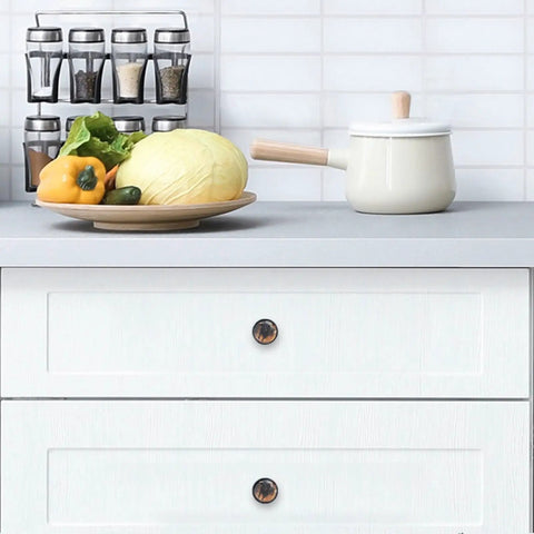 Four Pack Black Crystal Glass Cabinet Knobs 1.37 Inch Round Drawer Pulls for Kitchens, Dressers, and Closets installed on white drawers