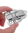 Close-up of a silver iron duckbilled toggle latch from Duckbilled Toggle Latches Set For Jewelry Boxes, Tool Chests, And Decorative Displays