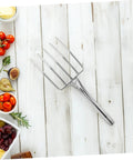 Stainless Steel Bean Sprout Fork Garden Trowel Small Digging Spade on wooden surface with vegetables around