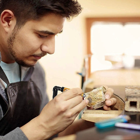 Person using Beefy Heavy Duty 1 Quarter Inch Flexible Shaft Rotary Tool With 780W Motor for precise metalworking task.