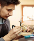 Man using Beefy 1000W 30,000 RPM Flex Shaft Rotary Tool With One Quarter Inch Shaft for detailed metalworking