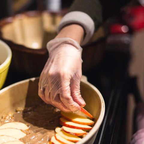 Heavy Duty Clear Vinyl Industrial Gloves Case Of 1000 Units 3 Mil Thick Build Large Roomy Fit Totally Latex And Powder Free Food Safe Disposable hand shields preparing apple slices.