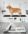 Heavy Duty Electric Dog Grooming Table With Smooth Operator Foot Pedal And Kickass Sturdy X Frame For Easy Height Adjustments And No Sweat Pet Styling In White, featuring a golden retriever.