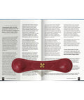Open book with red leather weighted bookmark with bronze accent corner page holder. Perfect for keeping pages open.