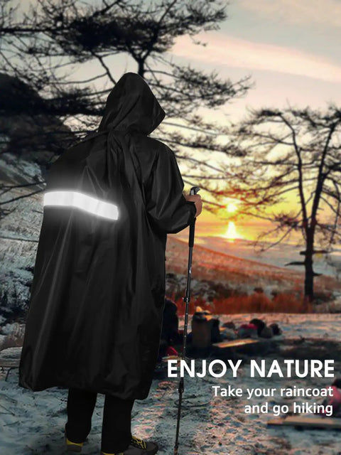 Person hiking at sunset wearing Waterproof Rain Jacket For Men And Women Lightweight Hooded Long Sleeve Packable Windbreaker Poncho.