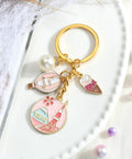 Tokyo Travel Keychain With Hot Air Balloon Ice Cream And Pearl Charms For Keys Cute Souvenir For Women Mt Fuji Silhouette Engraved Design Perfect Travel Keepsake For Japan Trips, shown with charms on white background