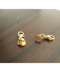 Close-up of two gold color magnetic clasps from 24 Piece Magnetic Lobster Clasps Set In Gold Color And Silver Color For Jewelry Making.