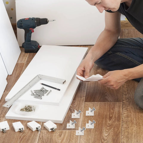 Person assembling cabinet with 120 Pcs Drawer Wedges With Stainless Steel Screws Kit for sagging drawers and reinforcement.