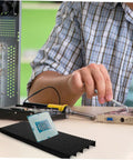 Man assembling circuit board with Antistatic Bar Rack Set For PCB Care And Storage, Split Tray Lid ESD Tray Organizer visible