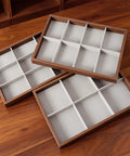 Dope Wooden Velvet Jewelry Organizer Tray With Nine Grid Compartments Stackable Ring Earring Necklace Valet Dish on wooden surface.