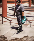 Man using 18V LXT Brushless Cordless Blower With Cruise Control, Variable Speed Trigger, And Speed Lock For Continuous Operation, Inline Fan Design For Superior Balance And Ergonomics, Tool Only on steps