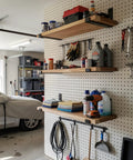 Garage wall with Heavy Duty 12 Inch Shelf Brackets Set Of 4 for DIY Floating Shelves, black powder coated supporting storage shelves.
