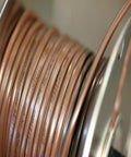 Close-up of Heavy Duty 18 Gauge 3 Conductor Thermostat Wire For Serious DIY Projects, brown jacket, coiled on spool
