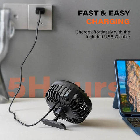 Rechargeable Golf Cart Fan With Magnetic Base And 360 Degree Rotating Head charging via USB-C cable next to tablet