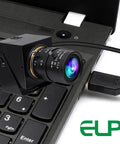 Global Shutter USB Camera With 10X Telephoto Zoom 5 To 50Mm Varifocal CS Mount Webcam shown connected to a laptop keyboard for detail capture