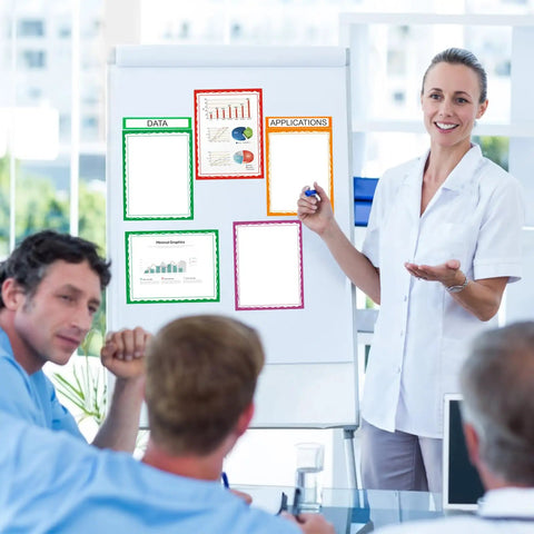 Woman presenting with colorful self adhesive science fair display kit on flip chart, featuring 22 sheets for classrooms or offices.