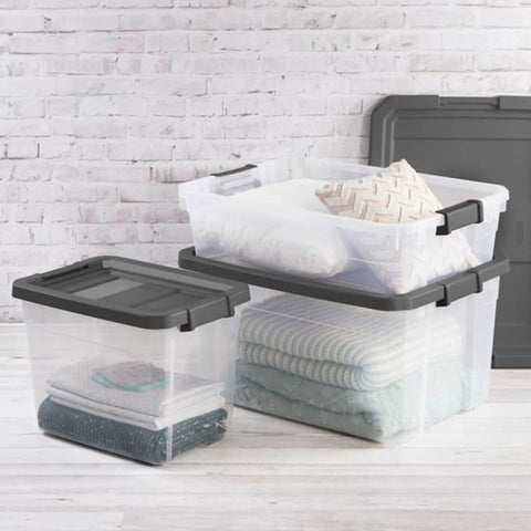Stacked Modular Clear Box Stacker 30 Quart Storage System with gray lids in a home setting, keeps gear neat and visible.