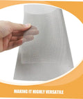 Hand holding a piece of stainless steel mesh from 4 Piece Quick Bumper Repair Mesh Kit, Stainless Steel Car Bumper Protector Mesh For Your Ride Auto Body Maintenance, Multi Purpose Metal Screen Patch For Bumpers And Other Car Parts, Durable Pro Grade Automotive Repair Tool.
