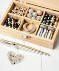 2 Packs Silver Soldering Sheets For Jewelry Make Secure Joints 0.08X0.08 Inch in a wooden jewelry storage box.