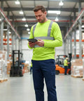 Shop Floor Ready Long Sleeve Hi Vis Safety Shirt With Bold Reflective Strips Class Three Ansi Certified Work Tee in warehouse setting.