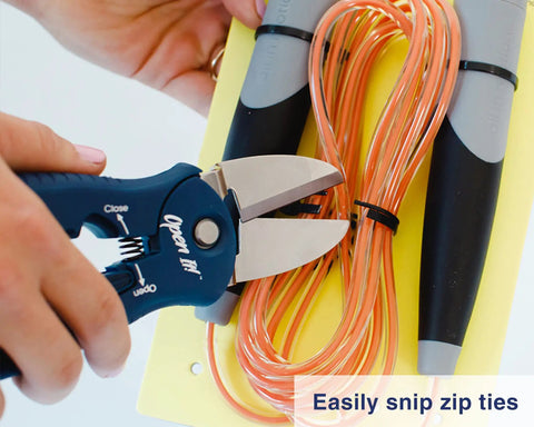 4-In-1 Box Cutter And Package Opener Tool With Heavy Duty Scissors snipping zip ties on cables.