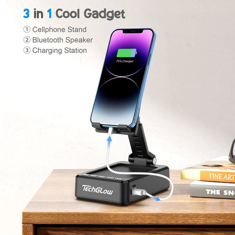 Foldable Phone Stand With Bluetooth Speaker And Built In Charging Station 3 In 1 Desk Gadget on wooden desk