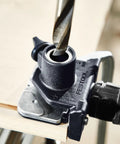 Domino Connector Kit For DF 500 Q System KV-SYS D8 in use, showcasing drill bit through connector for precise alignment.