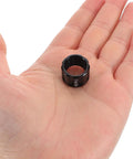 Rugged Aluminum Thru Axle Nut M15x1.5mm For Mountain Bikes And Electric Bikes in a person's hand, showcasing compact size.