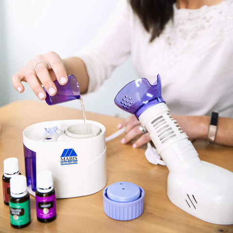 Person pouring water into Home Spa Facial Steamer With Aromatherapy Diffuser And Soft Face Mask, Adjustable Steam Control.