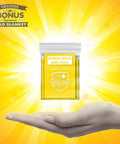 Gold Mylar blanket package labeled 'Bonus Gold Mini Fold' held in a hand against a bright yellow background.