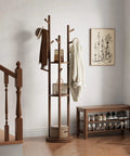 Solid Wood Rotary Coat Rack with 3 Shelves and 9 Hooks in walnut finish in entryway next to bench and stairs