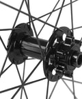 Close-up of center lock hub on carbon fiber disc brake wheelset for road bikes tubeless ready 28mm rim 55mm profile 700c