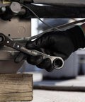Hand using 8-In-1 SAE Ratcheting Wrench Set In Two Pieces With Hollow Sockets And Double Box End Design Includes 5/16 3/8 7/16 9/16 5/8 11/16 3/4 Inch 12 Point Ratchet Heat Treated For Durability Made In USA on machinery