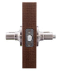 Privacy Lever Door Handle With Push Button Lock, Reversible For Left Or Right Hinging in satin nickel on wooden panel.
