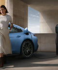 Rock Solid Level 1 And 2 EV Charger Featuring 16 Amp 3.5 Kw Quick Charge Heavy Duty Twenty Foot Cable at a blue electric vehicle.