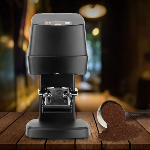 Top Shelf Electric Coffee Powder Tamper 58mm Portafilter Automatic Espresso Press on a wooden table with coffee grounds.